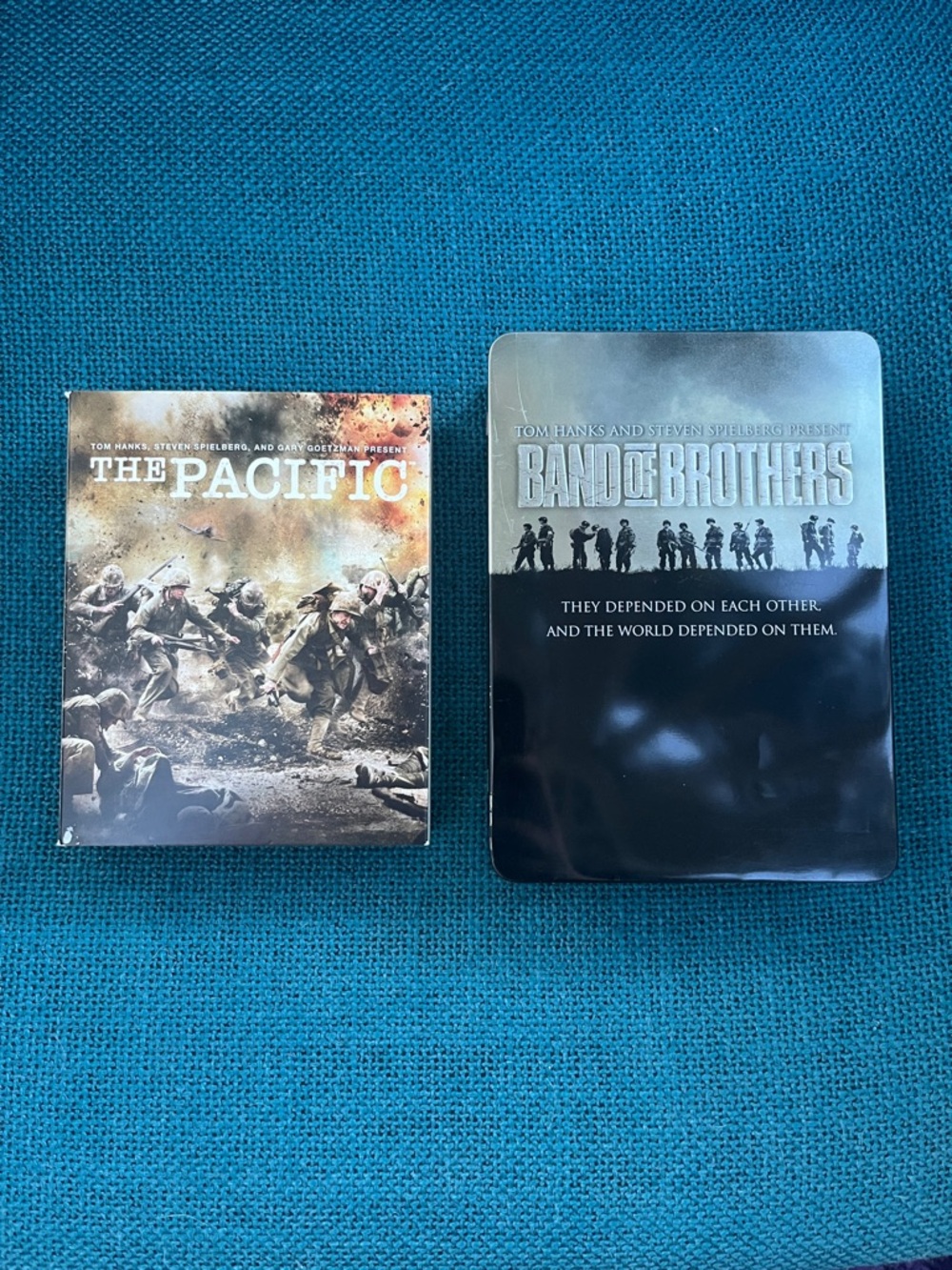 The Pacific and Band of Brothers DVD box sets.